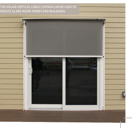 Solair® Vertical Cable Curtain lowered over a sliding glass door to cut glare