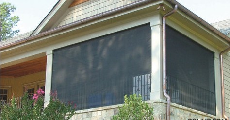 Solair® Power Screens enclosing an upper-level screened porch on a two-story home