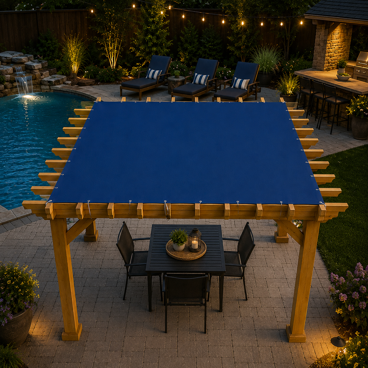 Custom navy shade top laced with stainless cable onto a cedar pergola over a poolside patio dining set at dusk — gazebo and pergola covers by Texas Made Shade