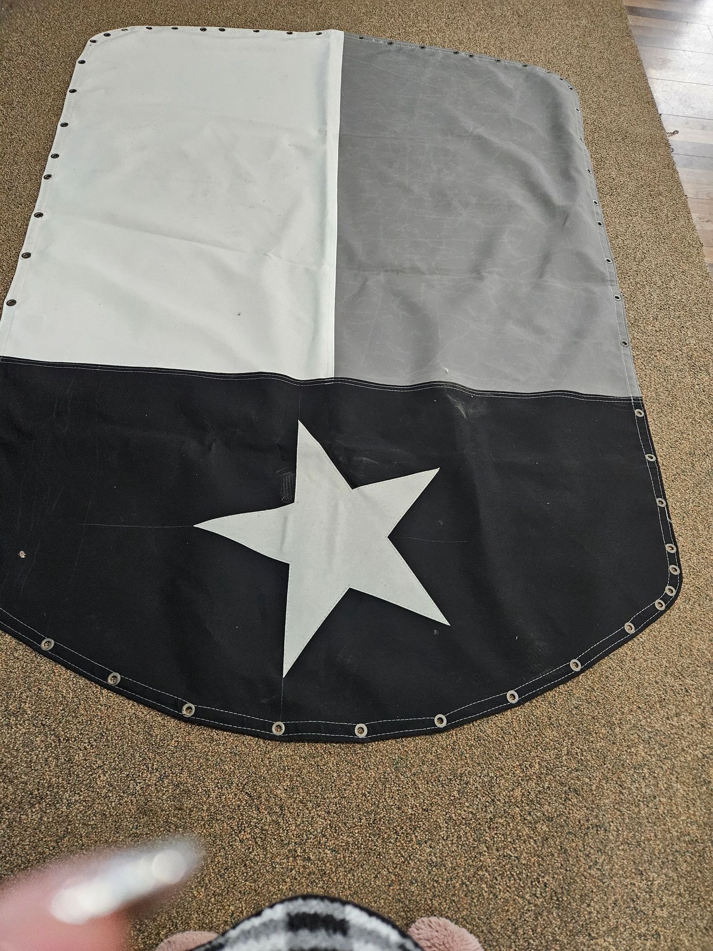 Sunbrella fabric piece with star design and grommets