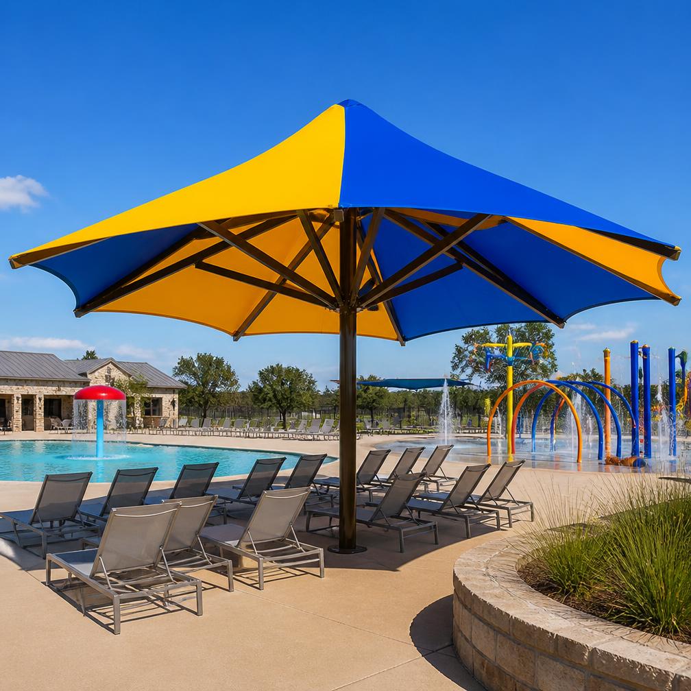Blue and yellow funbrella umbrella shade structure over a Texas pool deck and splash pad