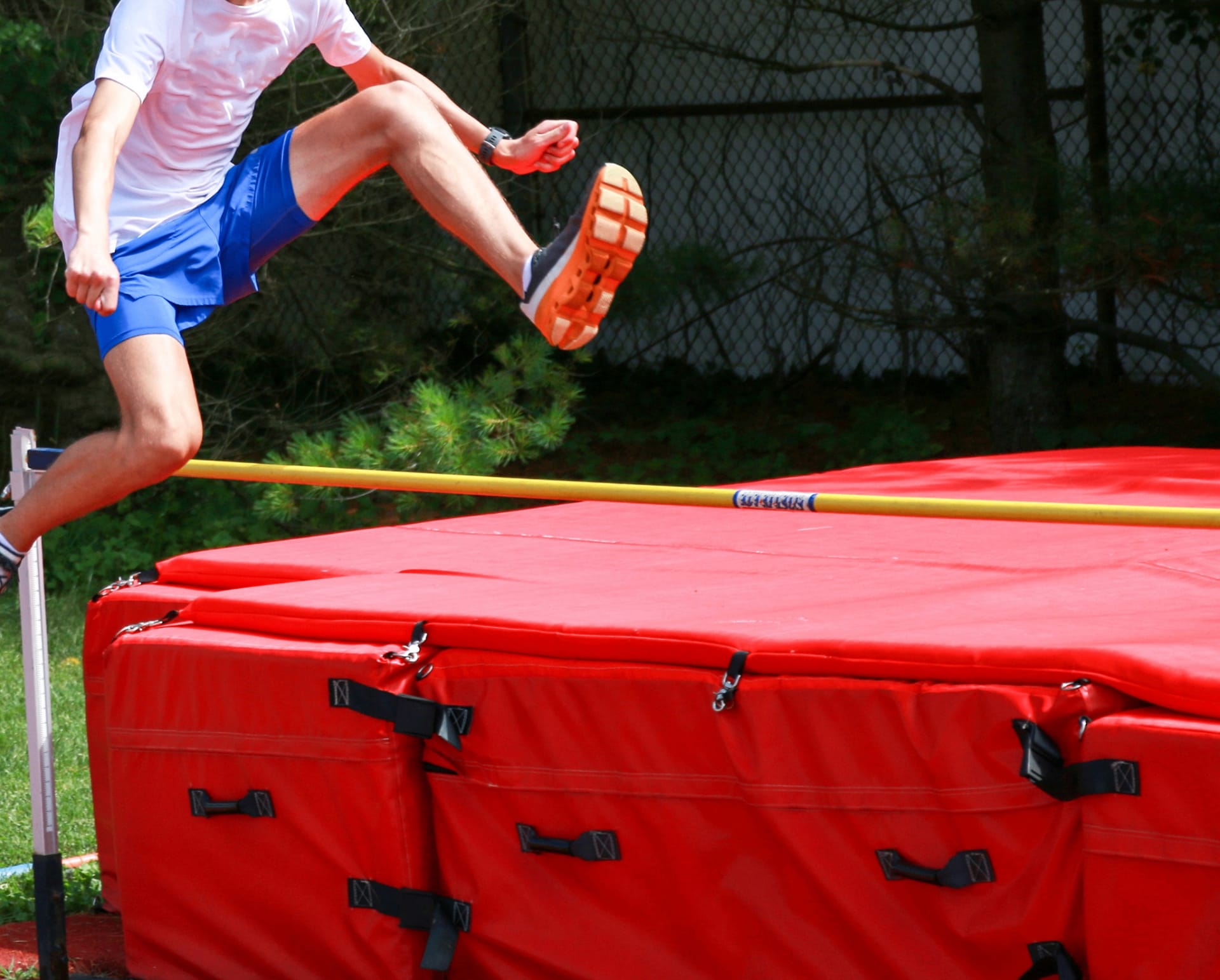 Heavy-duty high jump pit cover for a school track and field program